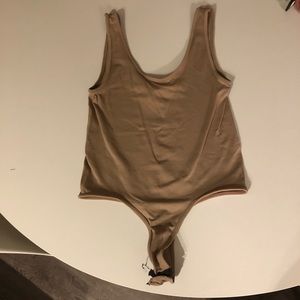 M- Boutique Blush pink bodysuit